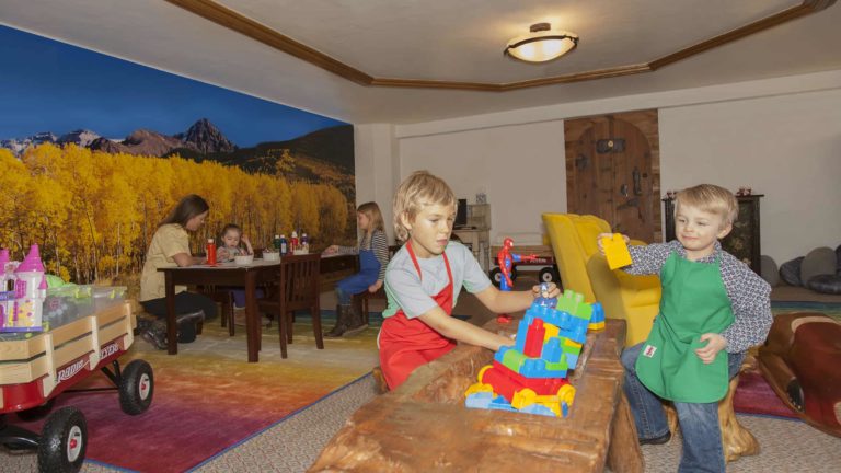 children playing with building blocks in room