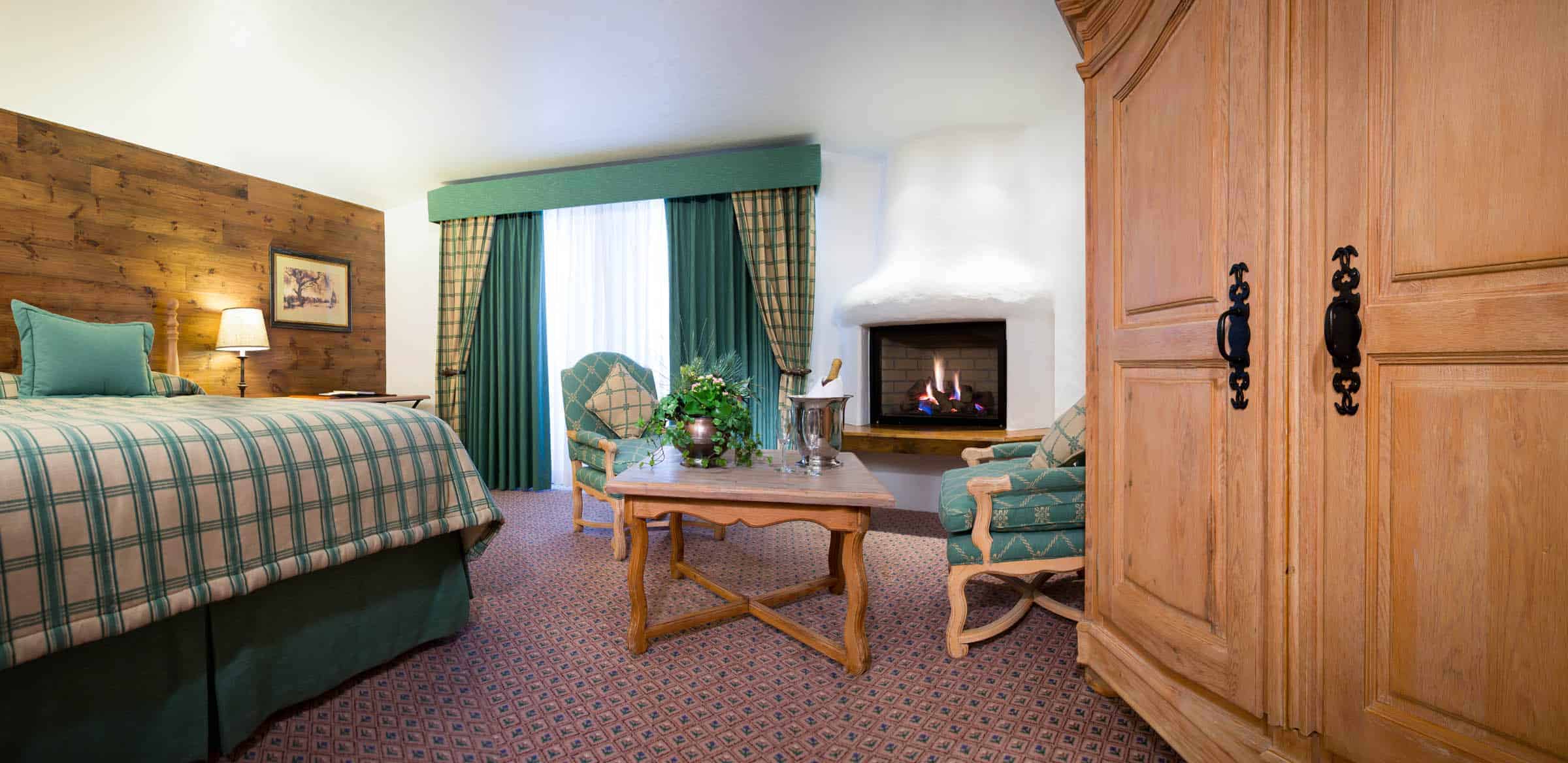 lodgepole jr suite with bed, chairs, table, and large dresser