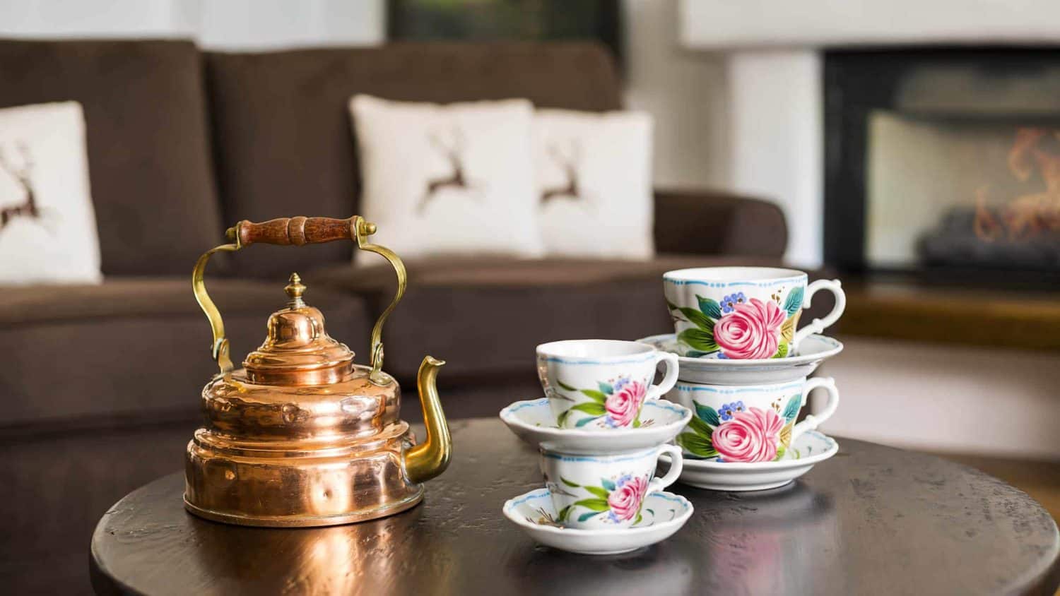 teapot and cups stacked on small round table