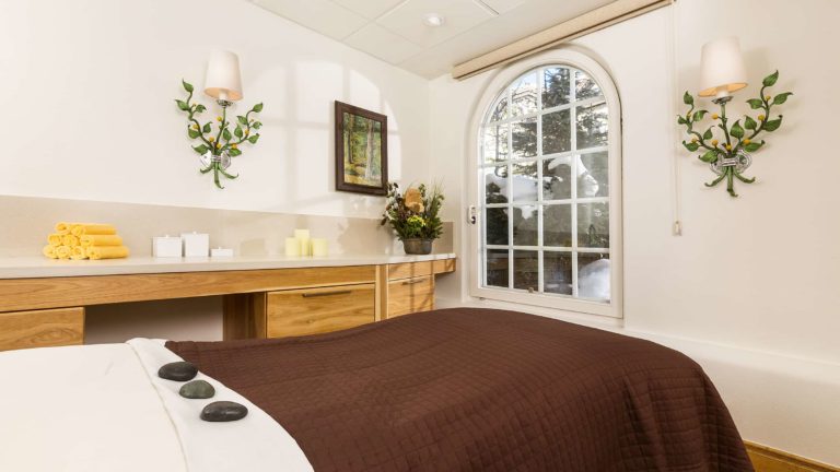 spa massage table and candles