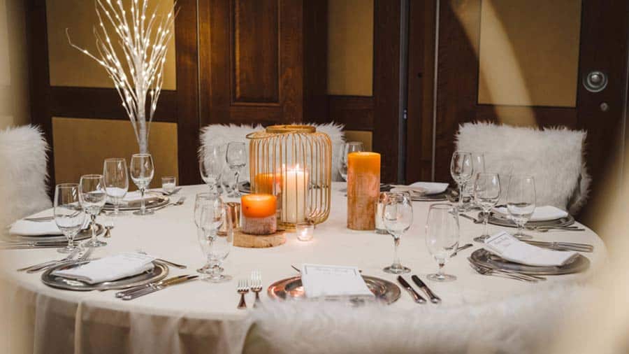Table with placesettings and candles