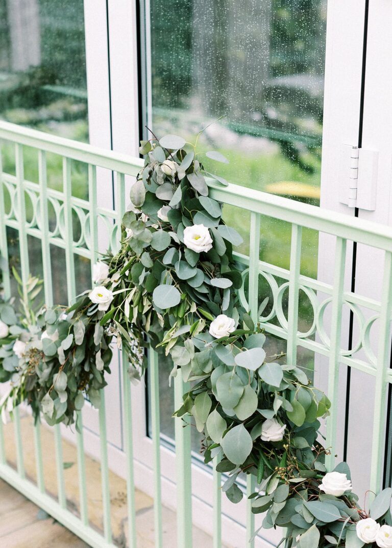Metal railing decorated with plants
