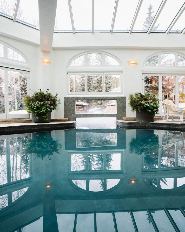 Indoor pool with skylights connected to outdoor pool