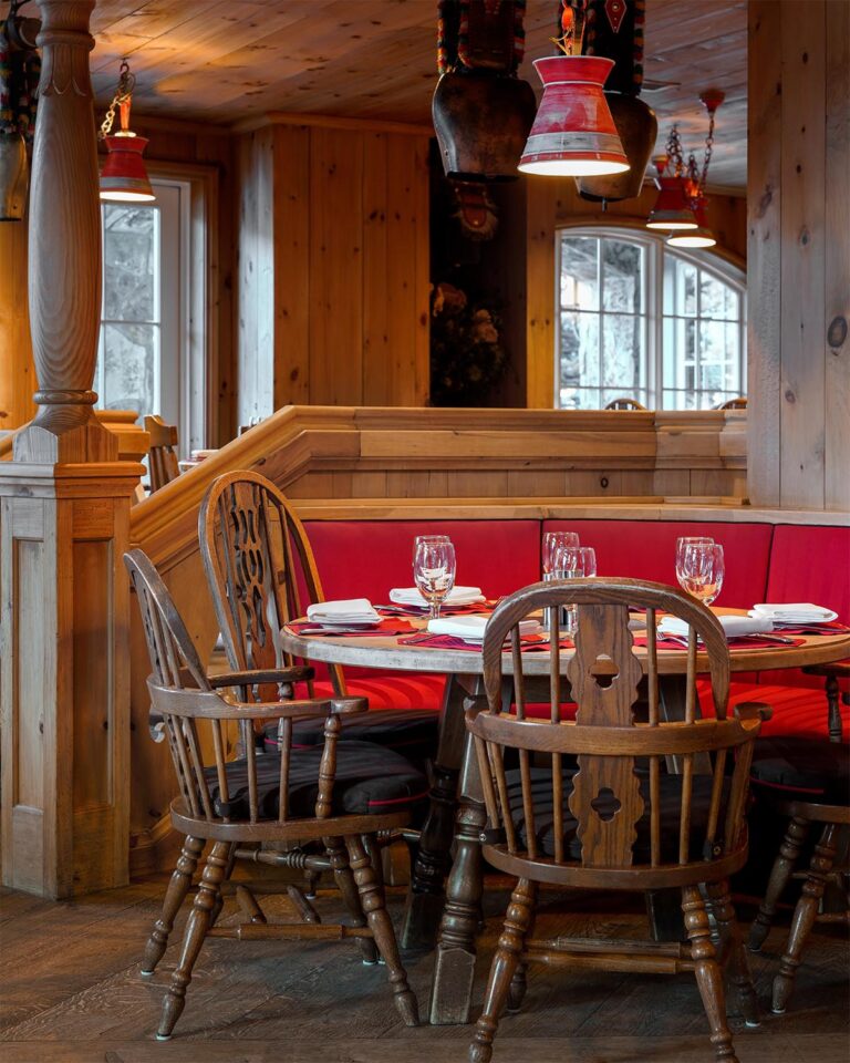 Restaurant booth and chairs and wooden walls