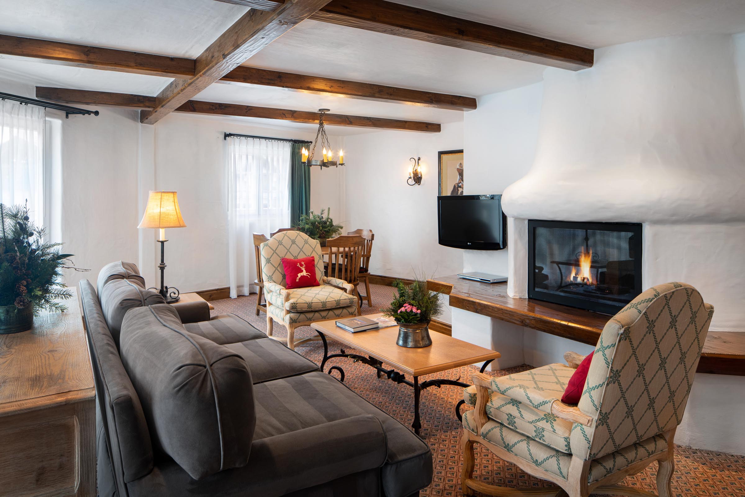 living room suite with fireplace, sofa, chairs, and coffee table