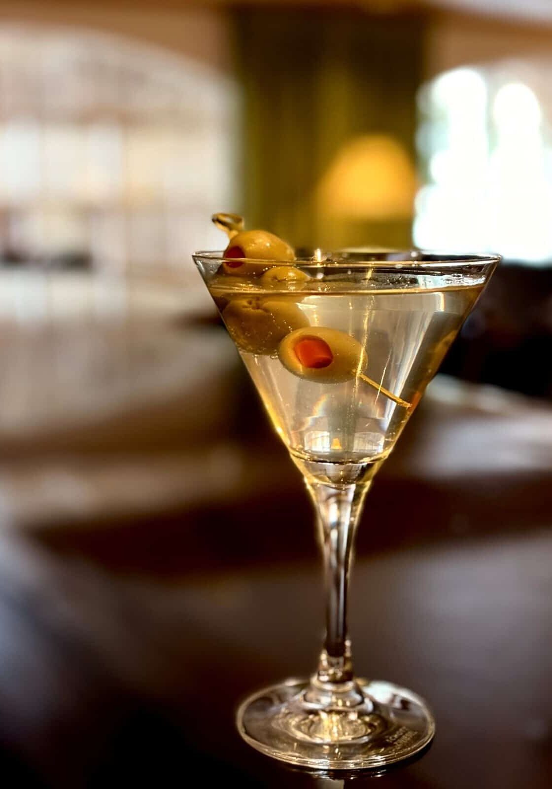Bar seating at the Sonnenalp King's Club with a martini cocktail on the counter