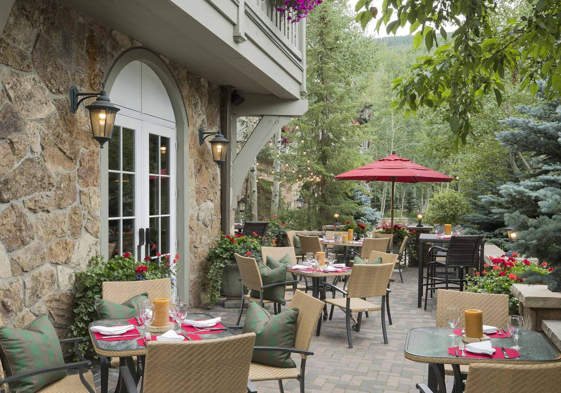 Sonnenalp Swiss Chalet outdoor patio with tables, and chairs