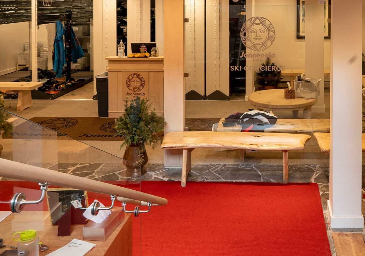 Ski shop with wooden benches, area for changing in the background