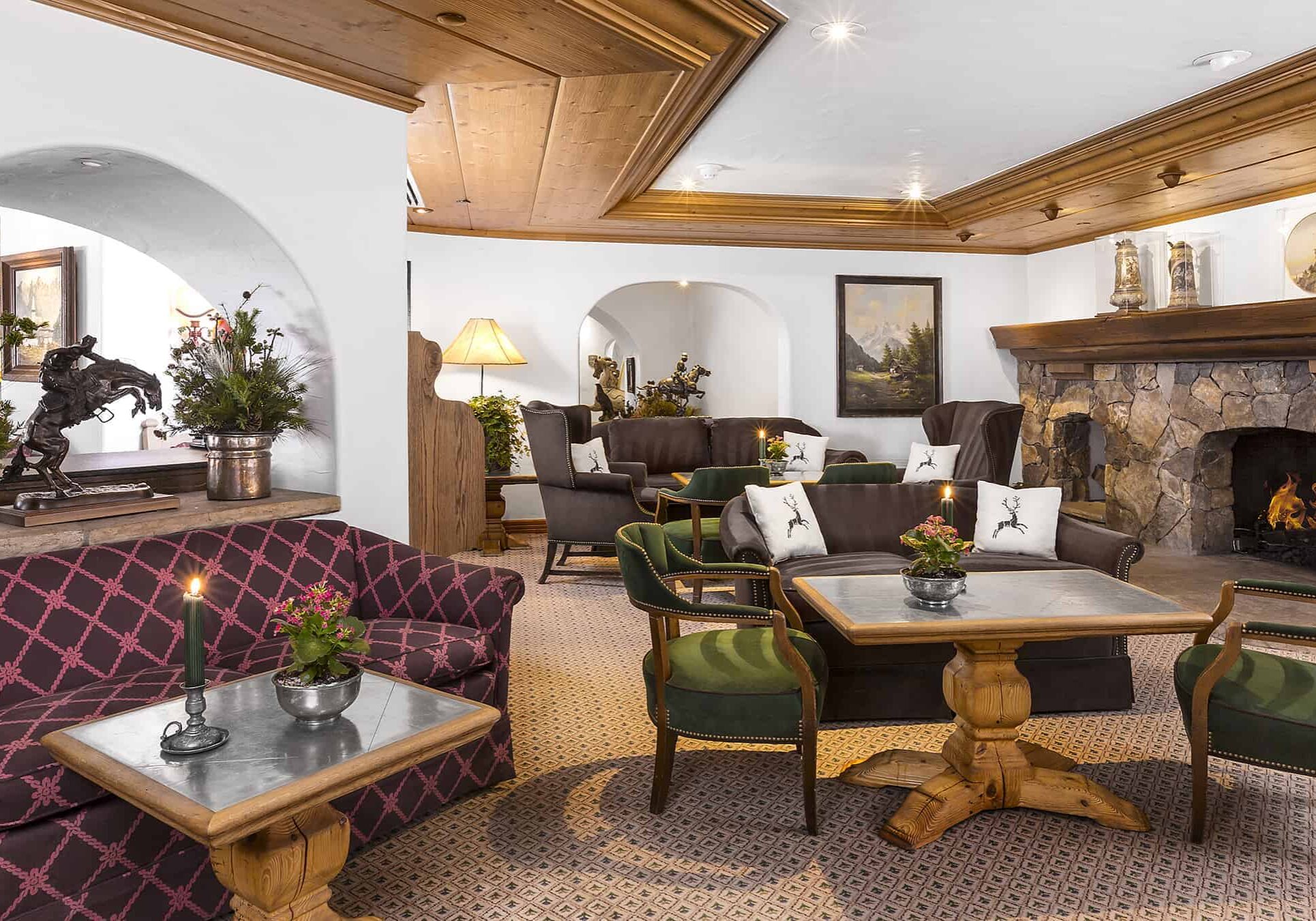 lounge with fireplaces, tables, chairs, sofas, and seating areas